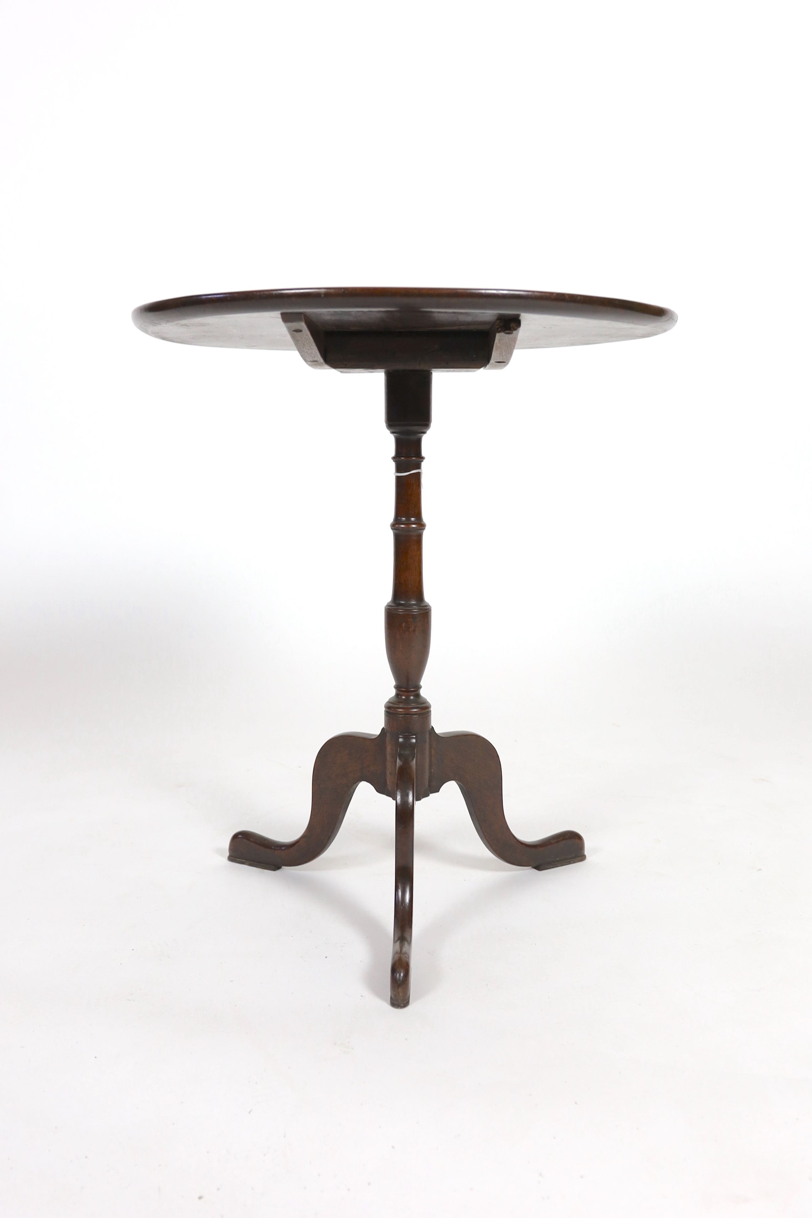 A George III circular mahogany tilt top tripod tea table, diameter 61cm height 70cm